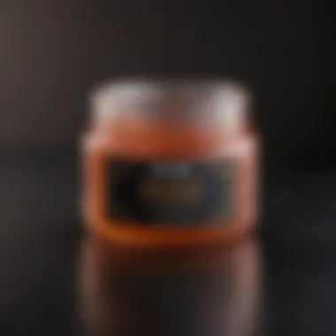 A close-up of a jar of detangler gel showcasing its smooth texture and vibrant color.