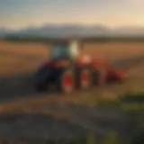 A Kubota tractor in a vast Canadian field during sunset