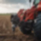 Close-up view of a hydraulic auger attachment on a tractor