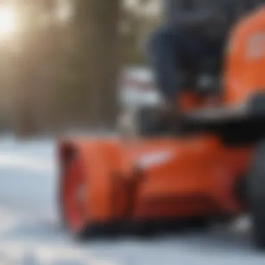 Close-up view of the snow blower attachment on a zero turn mower