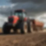 Tractor equipped with a gravel leveler on a field