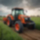 A Kubota small tractor navigating through a vibrant green field