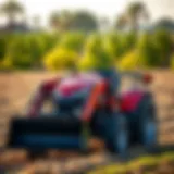 Compact Tractor with Front Bucket in Action Compact tractor with a front bucket in a field